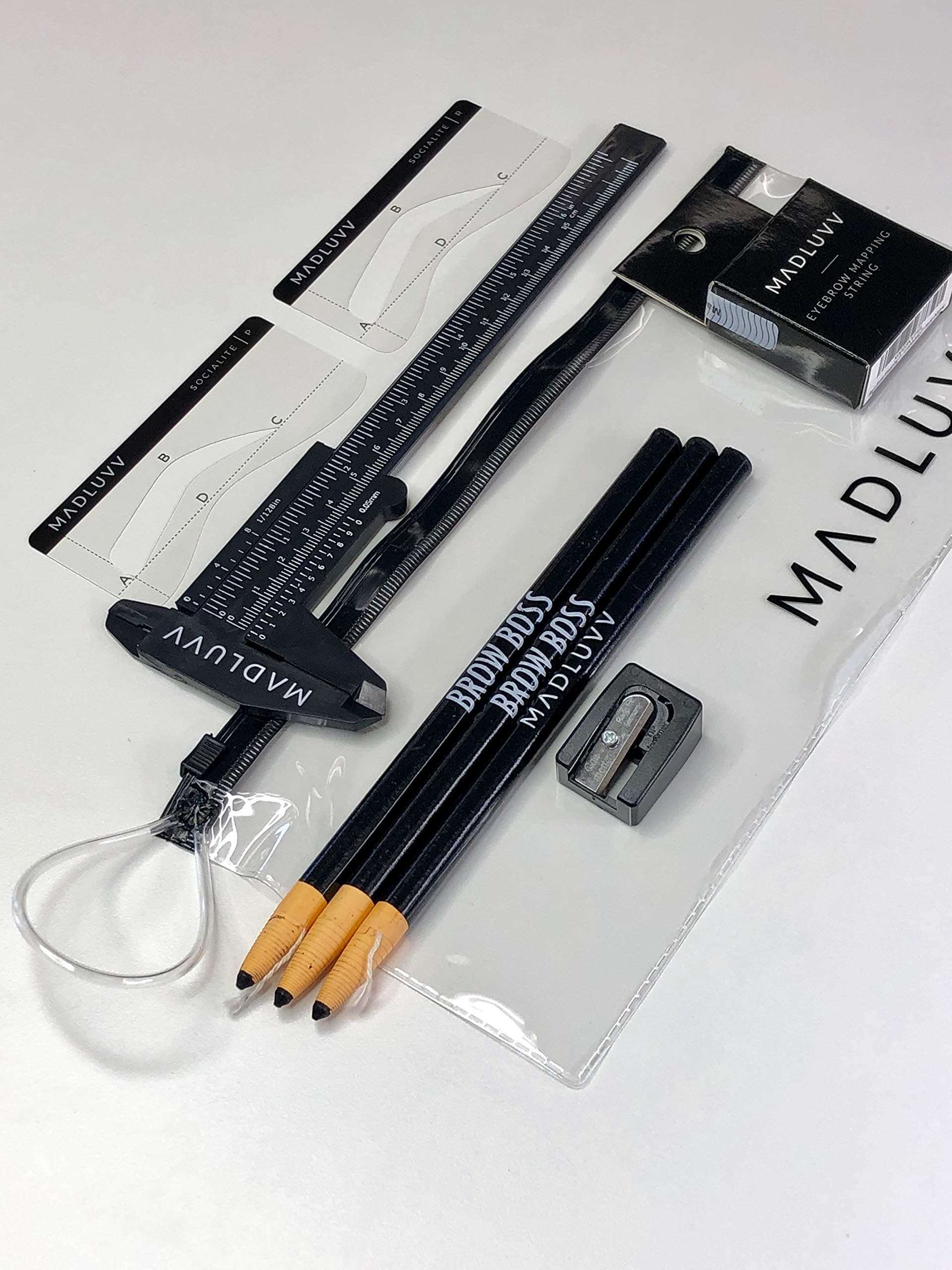 - MADLUVV Brow Mapping Kit for Professional Brow Artists to Create the Perfect Brow: Eyebrow Stencils, Mapping Pencils with Sharpener, Pre-Inked Mapping String, and Madluvv Eyebrow Caliper