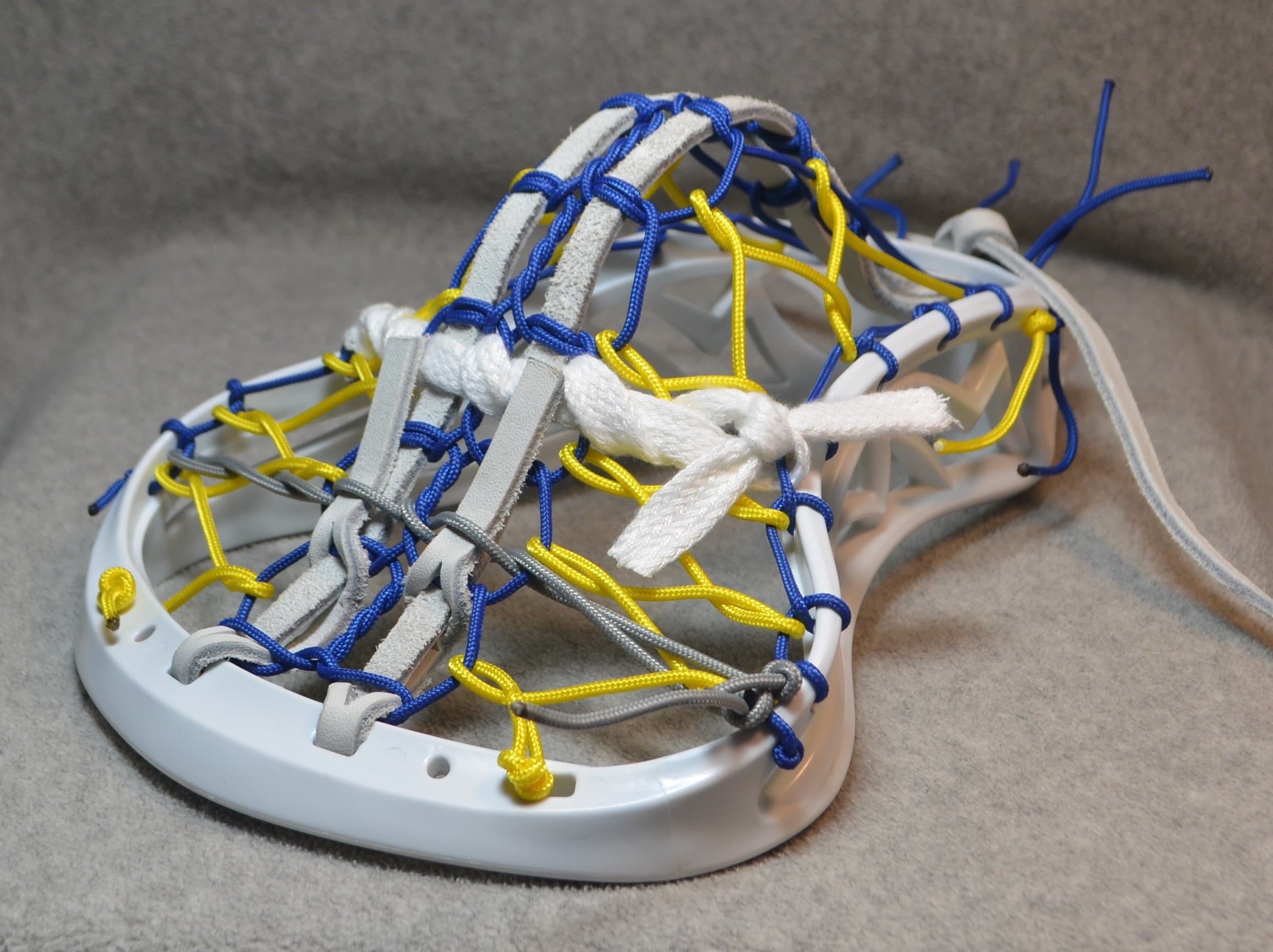 Rocket Inspired by MLL Florida Launch. B;ackfeet Lacrosse Mini Stick Traditional Strung Pita Pocket White Leathers - White Head with Yellow Finish Handle